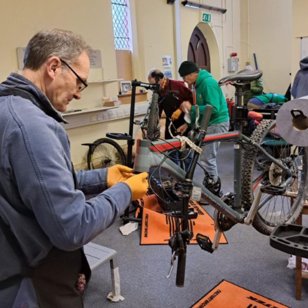 Mechanic fixing a mountain bike